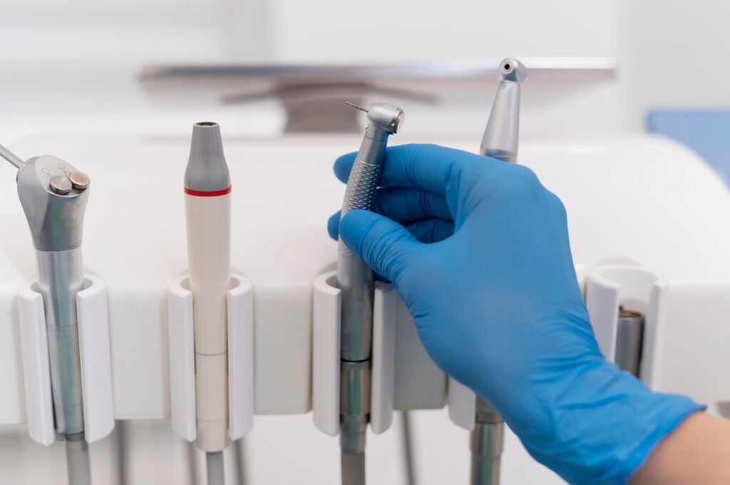 orthodontist-with-latex-glove-handling-dental-equipment_23-2148985839